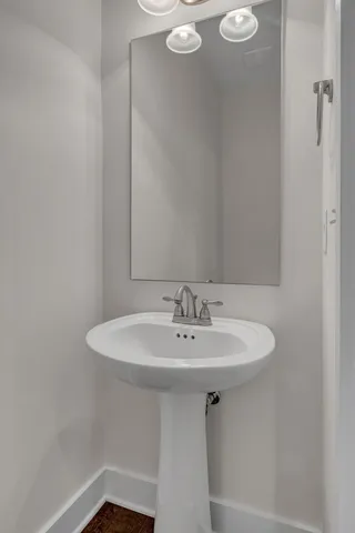 an empty room with a window and a ceiling fan