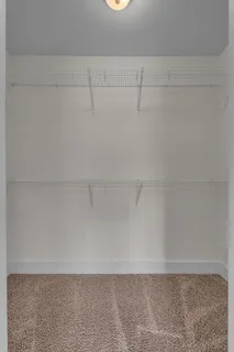 an empty room with closet area
