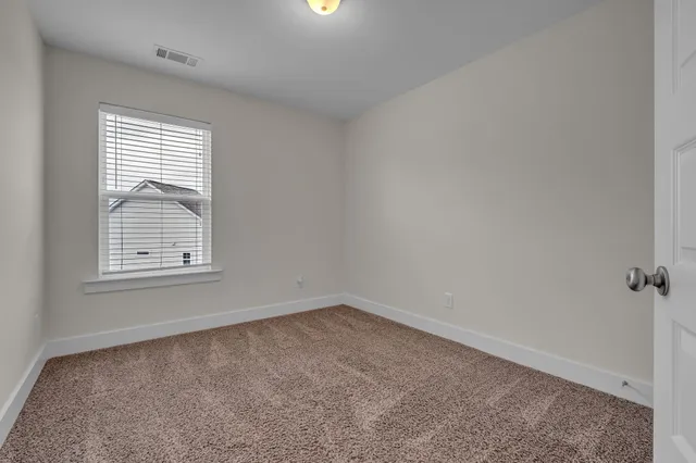 a bathroom with a sink toilet vanity and shower