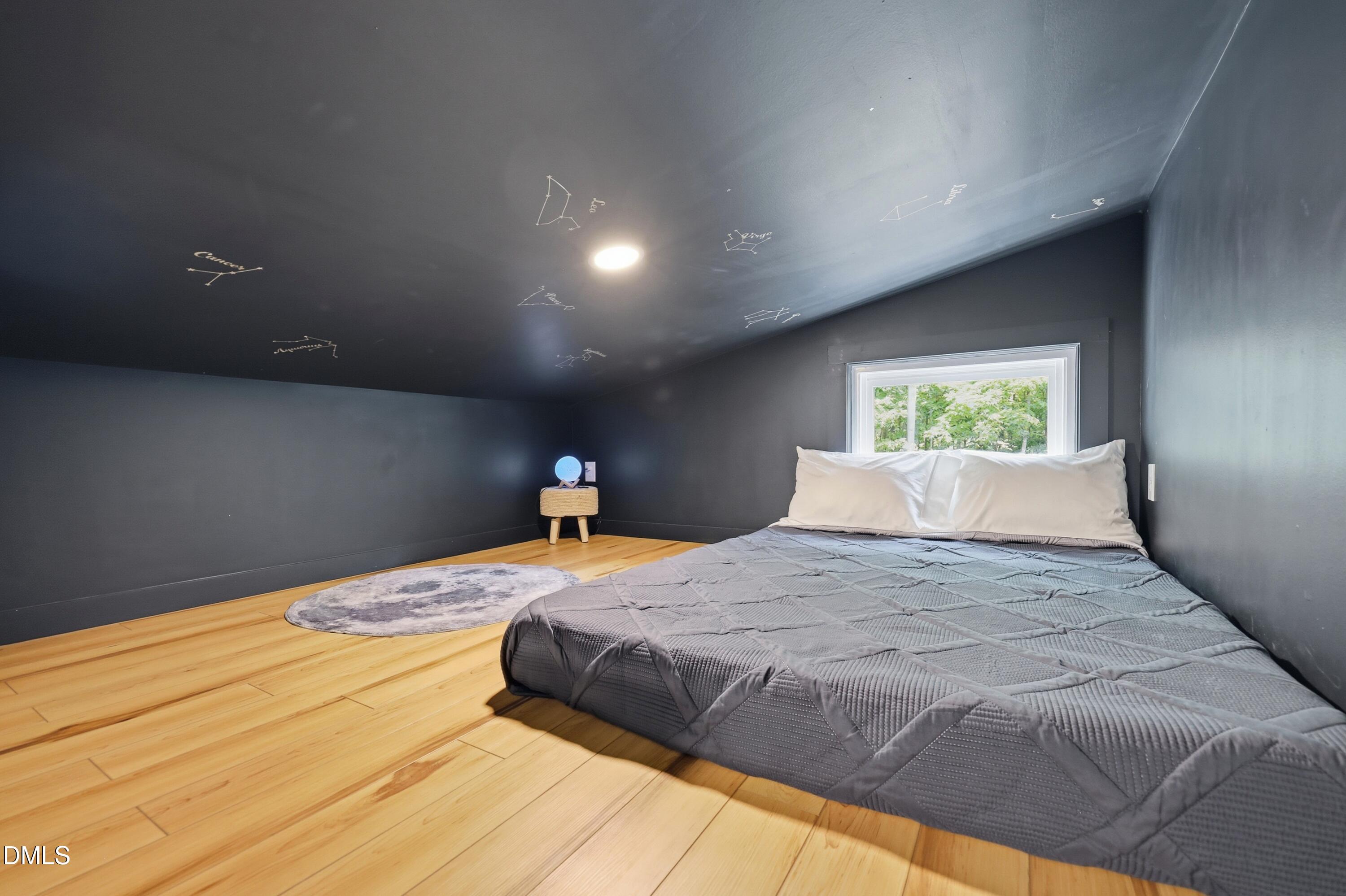 286 Stone Wall Road Pittsboro, NC 27312 - Photo 58 of 71 a bedroom with a large bed and a large window