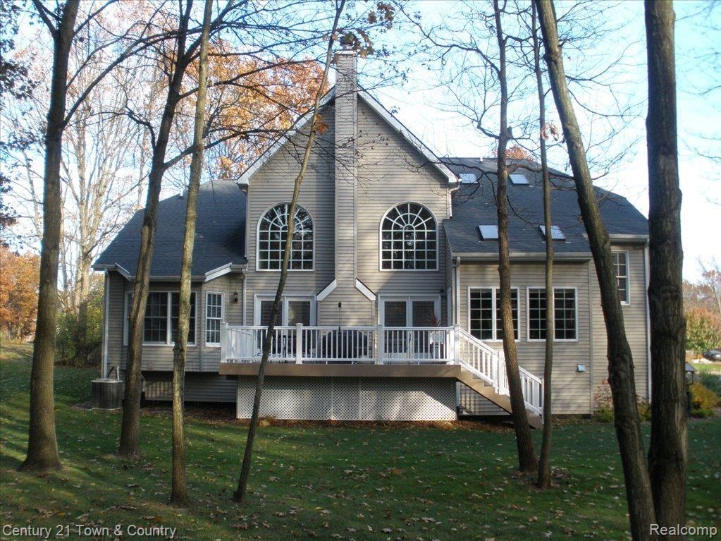 721 Timber Ridge Drive Highland, MI 48357 - Photo 5 of 25 Large windows maximize the views