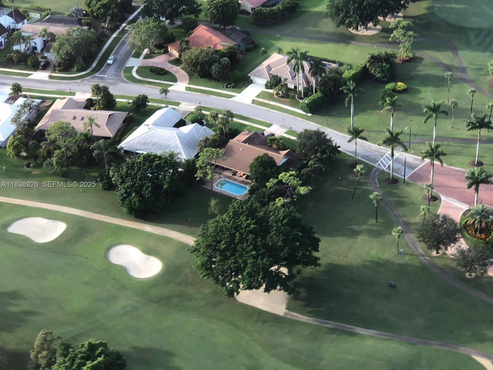 10134 Boca Woods Lane, Unit 10134 Boca Raton, FL 33428 - Photo 17 of 17 an aerial view of a house with yard swimming pool and outdoor seating