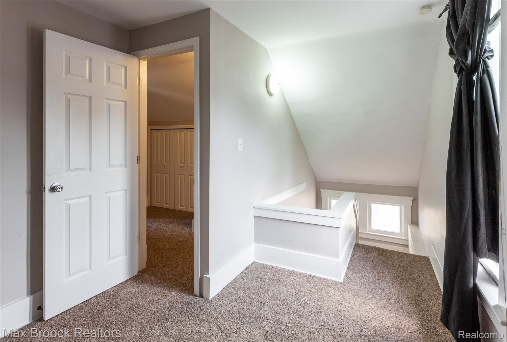 13071 East Thirteen Mile Road Warren, MI 48088 - Photo 13 of 23 Additional living space featuring carpet floors and lofted ceiling