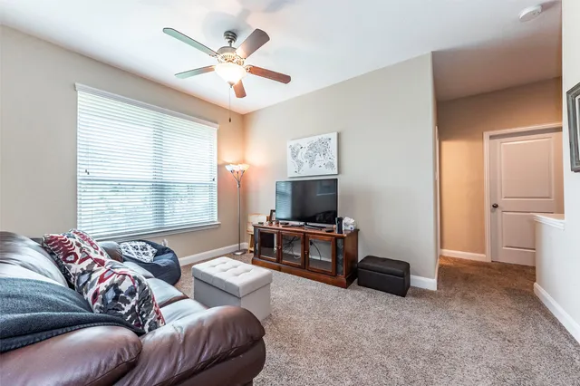 a kitchen with granite countertop a sink cabinets and stainless steel appliances