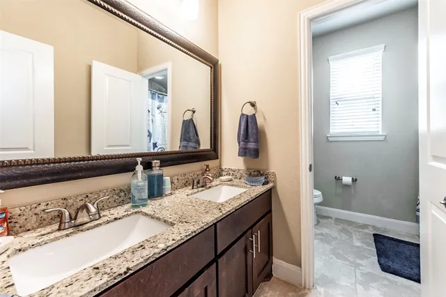 a view of a livingroom with furniture and staircase