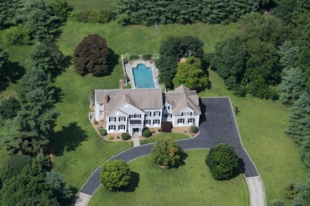 407 Belden Hill Road Wilton, CT 06897 - Photo 1 of 1 an aerial view of a house with a garden and lake view
