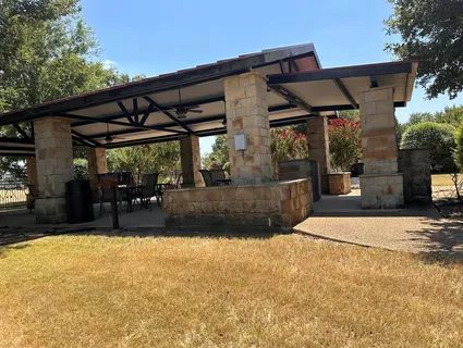 a swimming pool with outdoor seating and yard