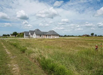 a view of a large body of water with lots of buildings in the background