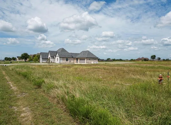 a view of a large body of water with lots of buildings in the background