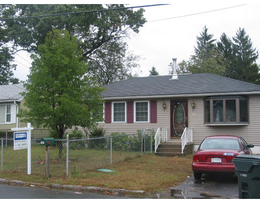 141 Gresham Street Springfield, MA 01119 - Photo 1 of 2 a front view of a house with garden