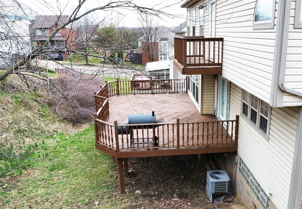 728 Mercer Street Pittsburgh, PA 15219 - Photo 25 of 27 a view of a wooden deck with chairs and a yard
