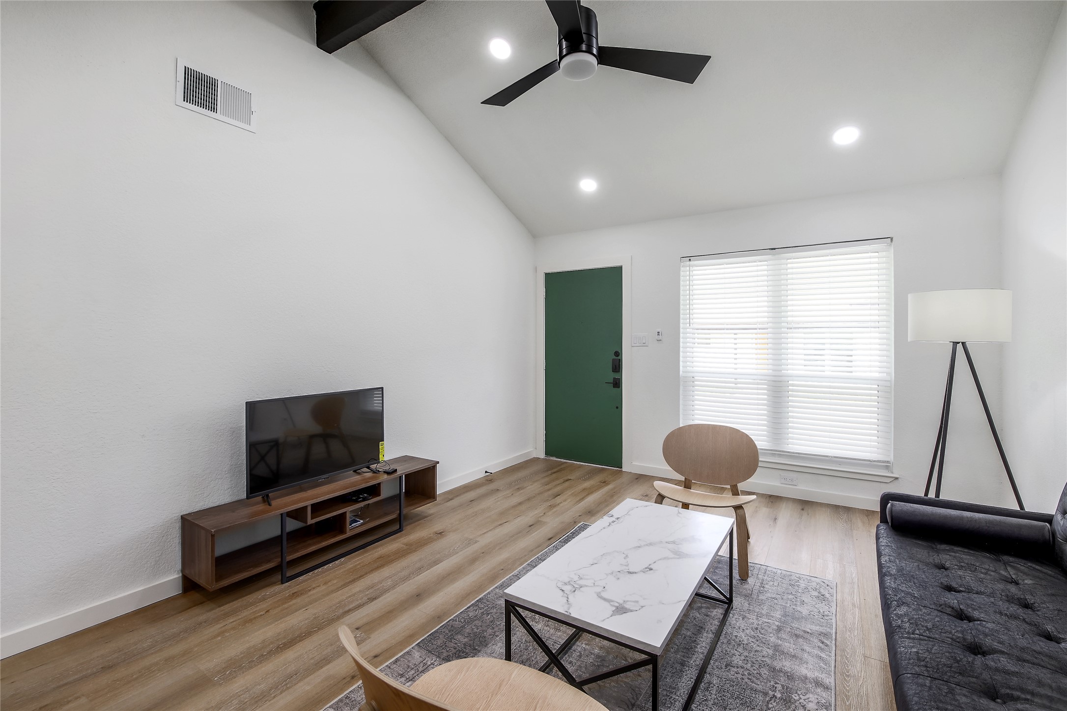 10509 Macmora Road, Unit B Austin, TX 78758 - Photo 19 of 19 a living room with furniture and a flat screen tv