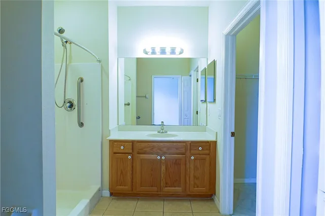 a bathroom with a sink a vanity and a mirror