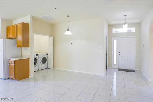 a view of a livingroom with a furniture and chandelier