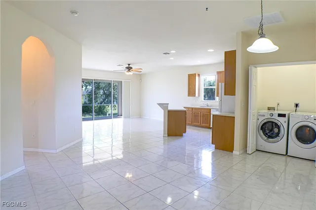 a view of living room with furniture and a fireplace