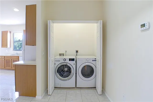 a utility room with dryer and washer