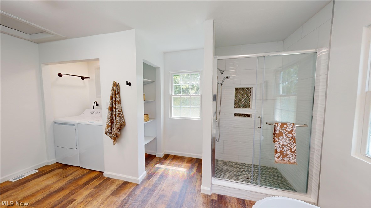 3075 Ludlow Road Cleveland, OH 44120 - Photo 23 of 30 2nd floor Bathroom with washer and dryer, a shower with shower door, and wood-type flooring