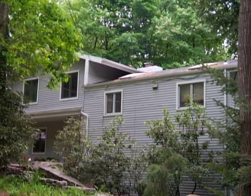 211 Gary Road Stamford, CT 06903 - Photo 1 of 1 a view of a house with a yard