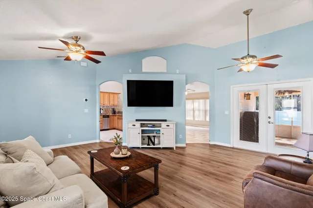 a living room with furniture fireplace and a flat screen tv