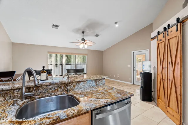 a kitchen with a sink stove and refrigerator