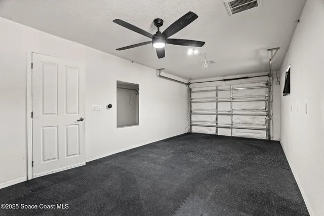 an aerial view of a house with garden space and street view