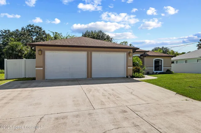 a house view with a garden space