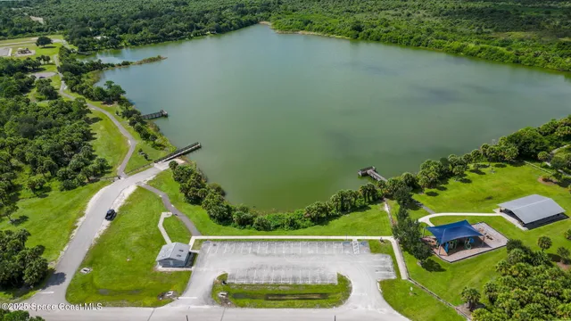 an aerial view of a houses with outdoor space