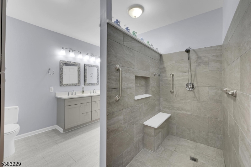 7 Ridgeview Lane, Unit 7 Mount Arlington, NJ 07856 - Photo 12 of 33 a bathroom with a sink a toilet and shower