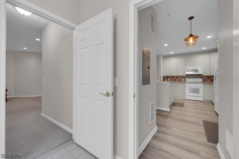 7 Ridgeview Lane, Unit 7 Mount Arlington, NJ 07856 - Photo 13 of 33 a view of a kitchen with a sink and wooden floor