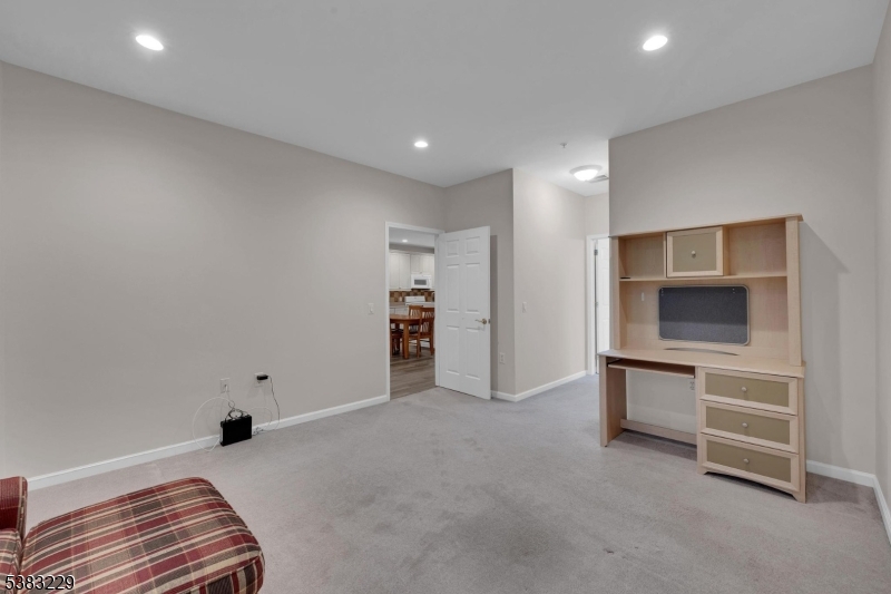 7 Ridgeview Lane, Unit 7 Mount Arlington, NJ 07856 - Photo 18 of 33 a view of an empty room with a fireplace