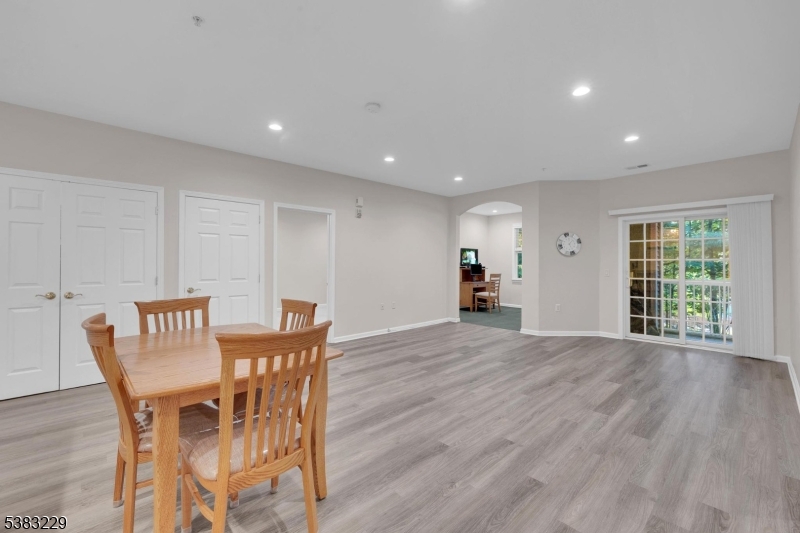7 Ridgeview Lane, Unit 7 Mount Arlington, NJ 07856 - Photo 20 of 33 a view of a kitchen with dining room and wooden floor