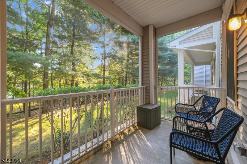 7 Ridgeview Lane, Unit 7 Mount Arlington, NJ 07856 - Photo 2 of 33 a balcony with chairs and a swing