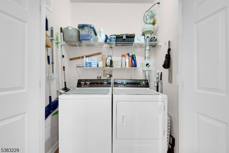 7 Ridgeview Lane, Unit 7 Mount Arlington, NJ 07856 - Photo 28 of 33 a storage room with washer and dryer