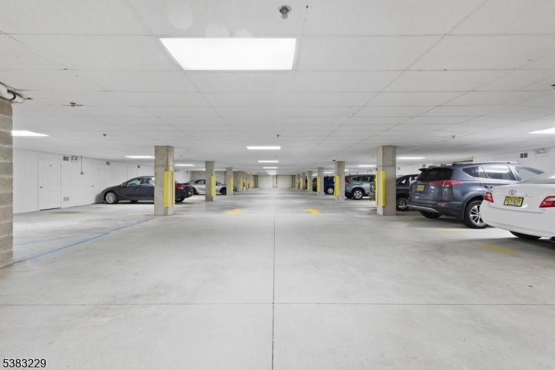 7 Ridgeview Lane, Unit 7 Mount Arlington, NJ 07856 - Photo 32 of 33 a living room with furniture and a table