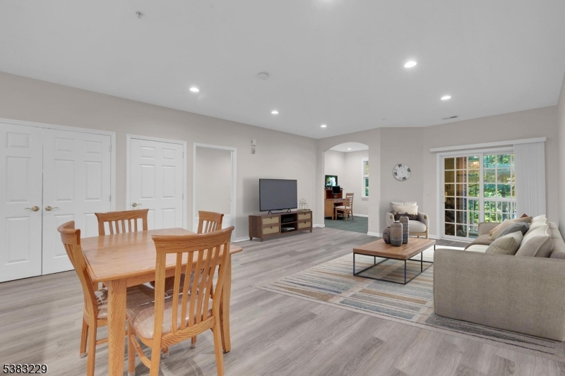 7 Ridgeview Lane, Unit 7 Mount Arlington, NJ 07856 - Photo 4 of 33 a living room with furniture and a wooden floor