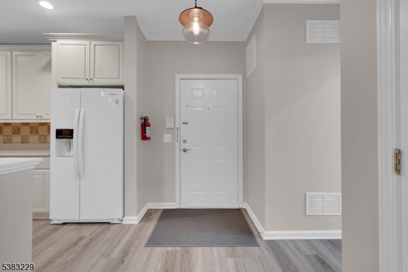 7 Ridgeview Lane, Unit 7 Mount Arlington, NJ 07856 - Photo 8 of 33 an entryway with wooden floor and cabinet