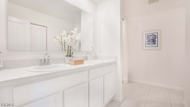 3715 32nd Street Southwest Lehigh Acres, FL 33976 - Photo 11 of 19 a bathroom with a sink and a mirror