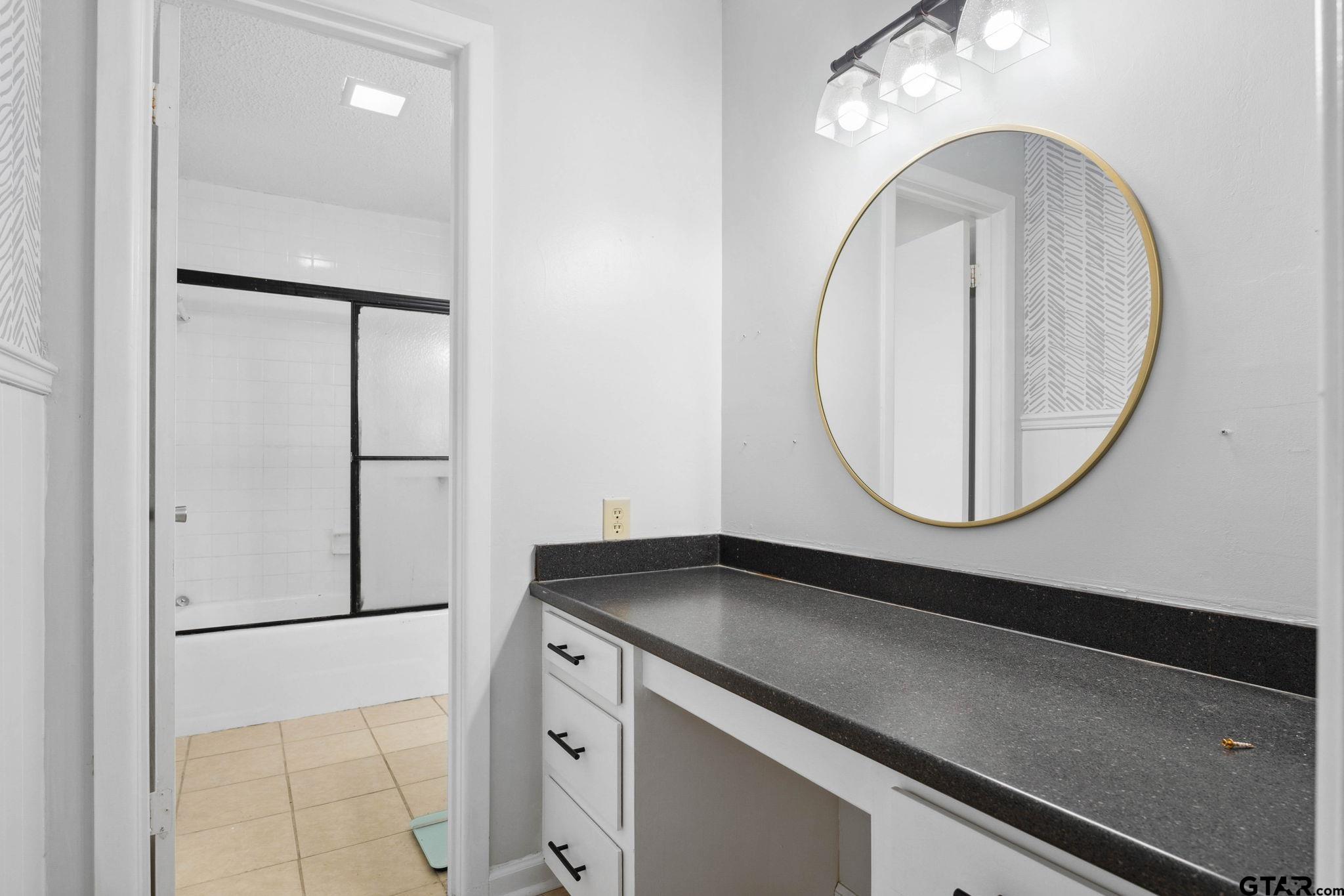8224 Purdue Drive Tyler, TX 75703 - Photo 19 of 39 a close view of utility room with washer and dryer