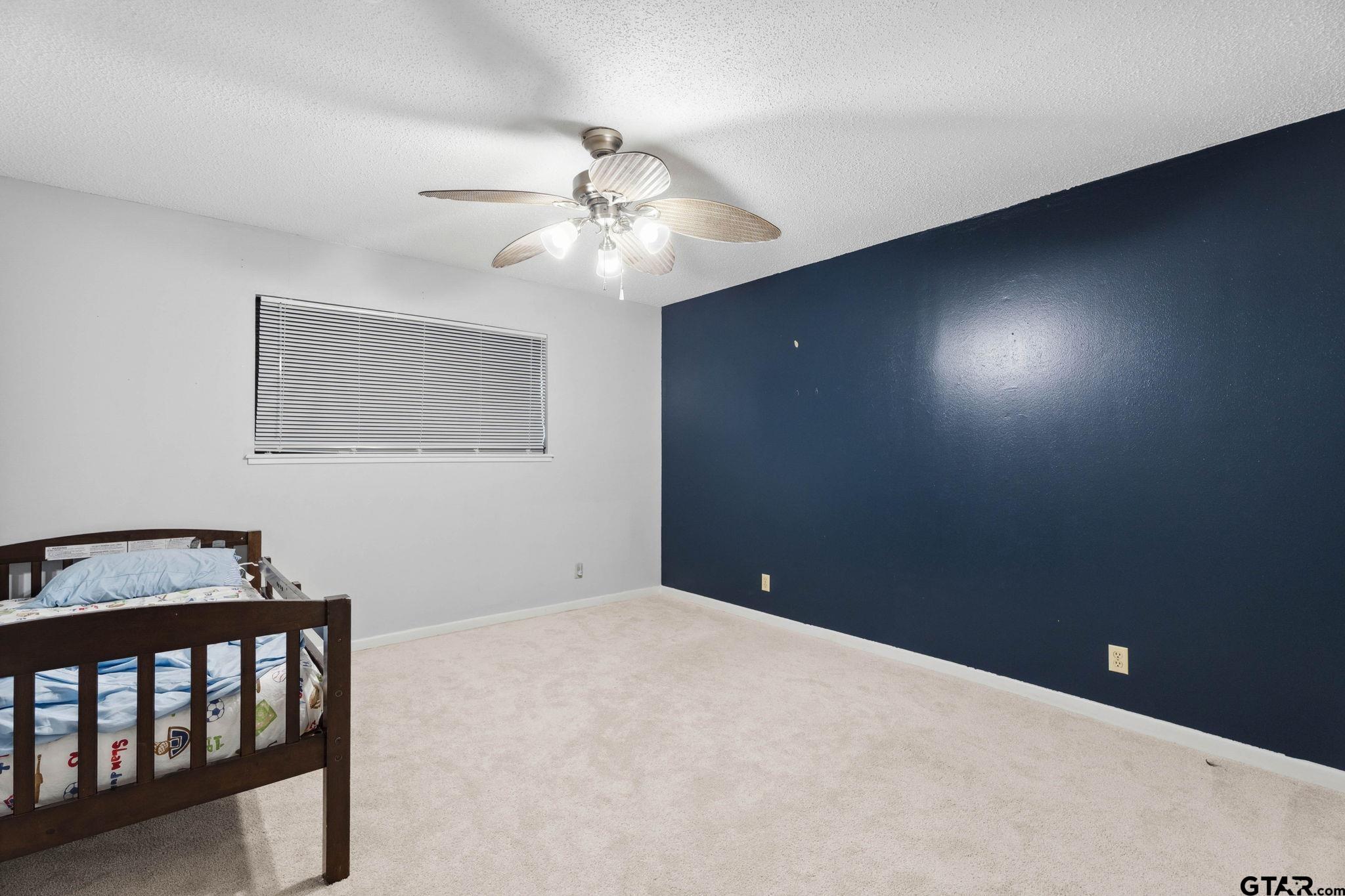 8224 Purdue Drive Tyler, TX 75703 - Photo 26 of 39 a view of an empty room with a fan