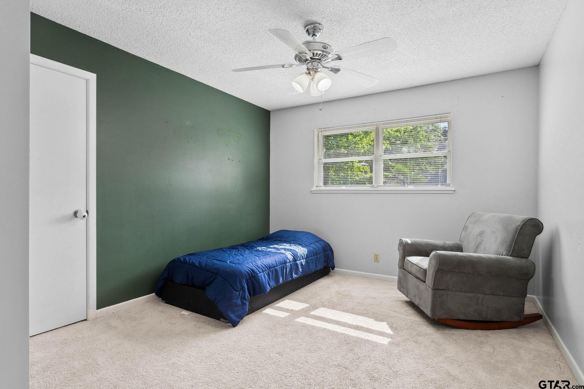 8224 Purdue Drive Tyler, TX 75703 - Photo 29 of 39 a bedroom with furniture and a window