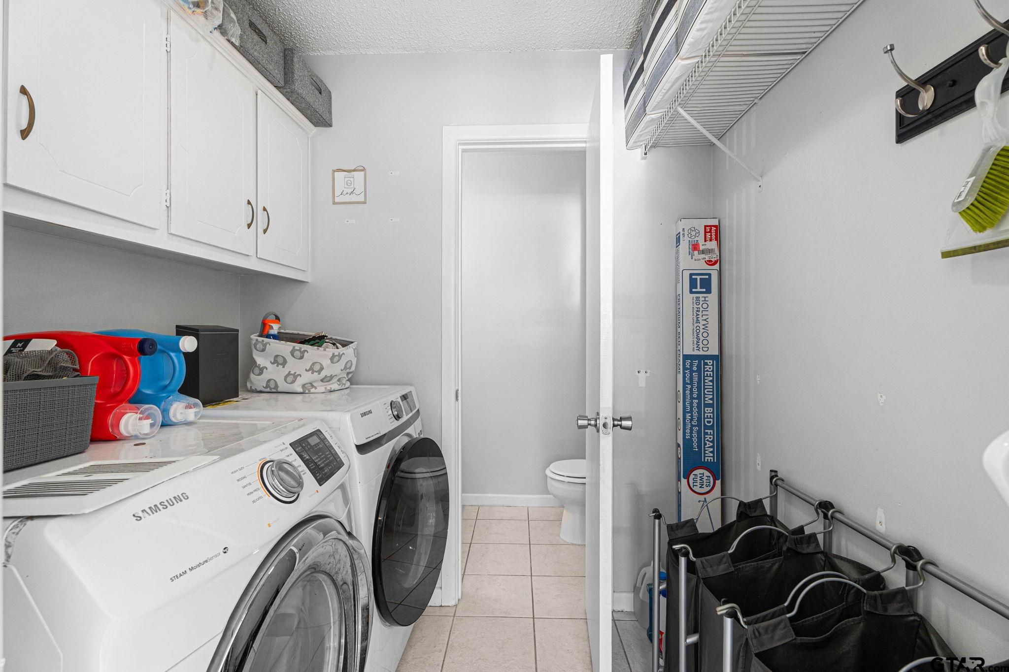 8224 Purdue Drive Tyler, TX 75703 - Photo 31 of 39 a utility room with dryer and washer