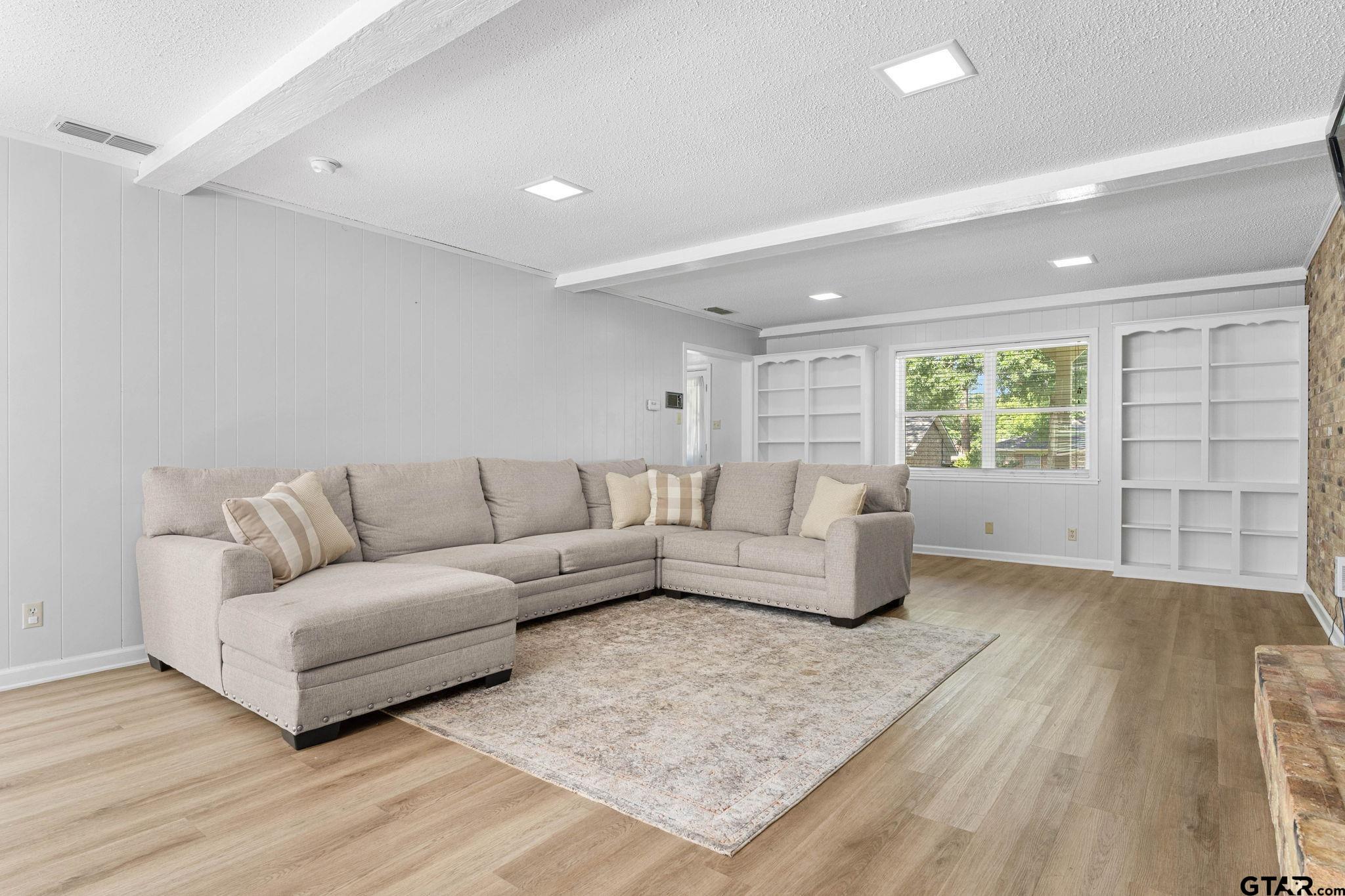 8224 Purdue Drive Tyler, TX 75703 - Photo 6 of 39 a living room with furniture and a window