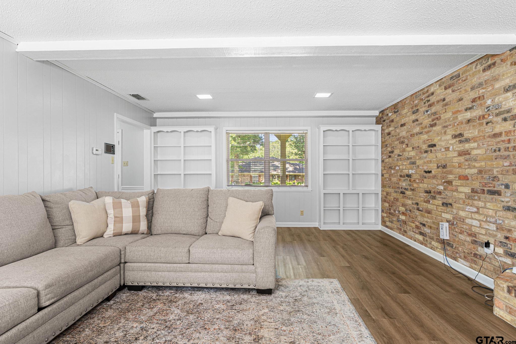 8224 Purdue Drive Tyler, TX 75703 - Photo 7 of 39 a living room with furniture and a large window