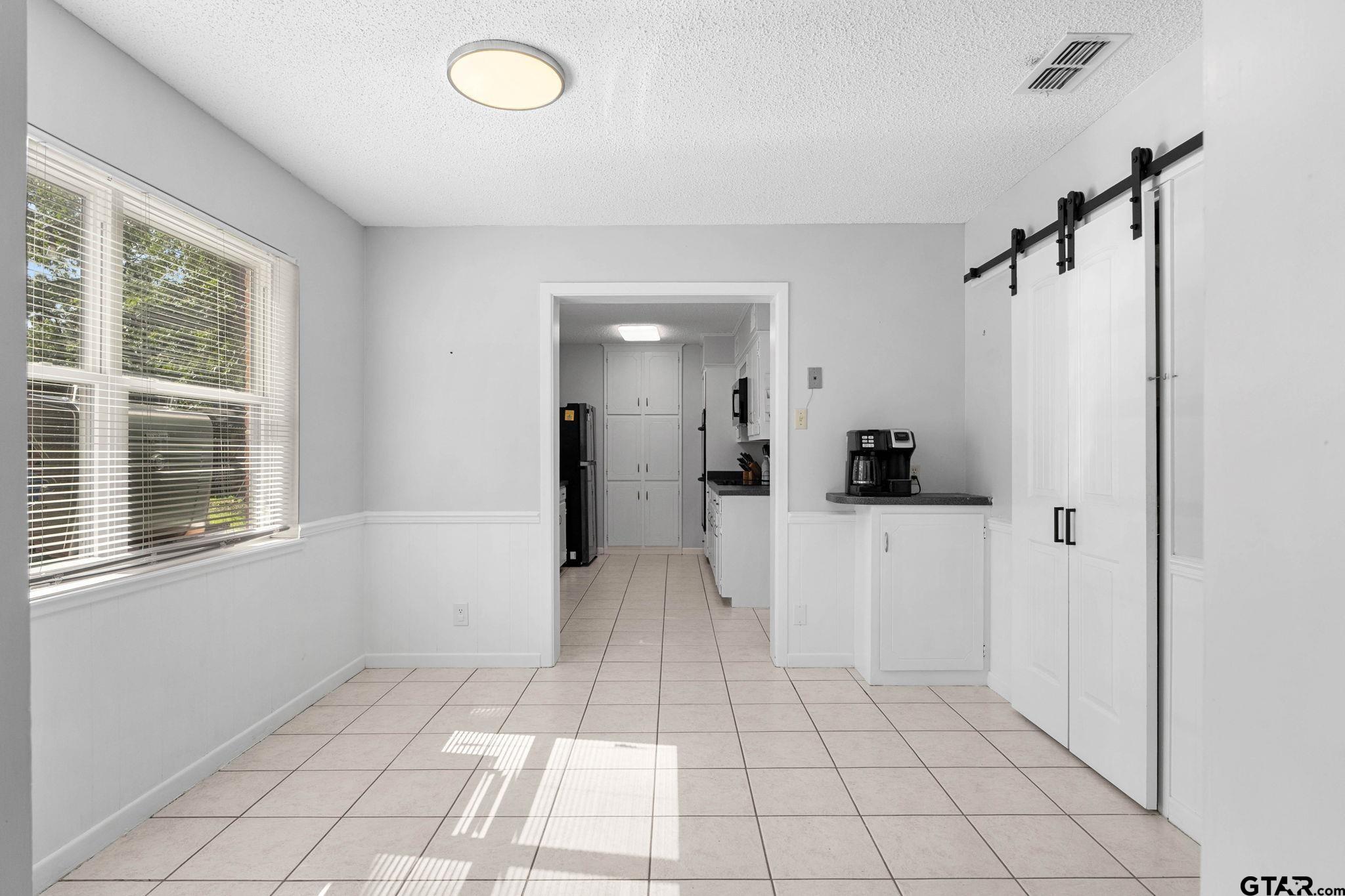 8224 Purdue Drive Tyler, TX 75703 - Photo 9 of 39 a view of a storage & utility room with a window