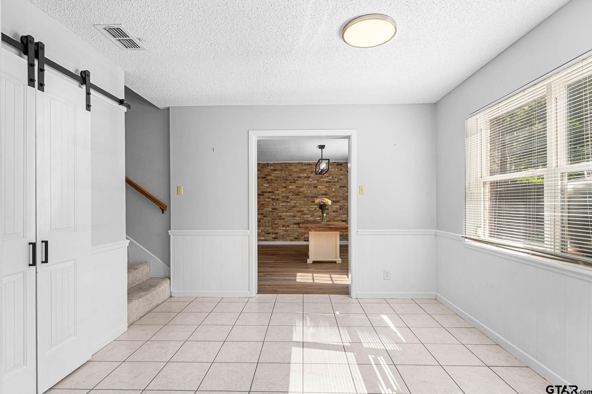 8224 Purdue Drive Tyler, TX 75703 - Photo 10 of 39 a view of an empty room with a window