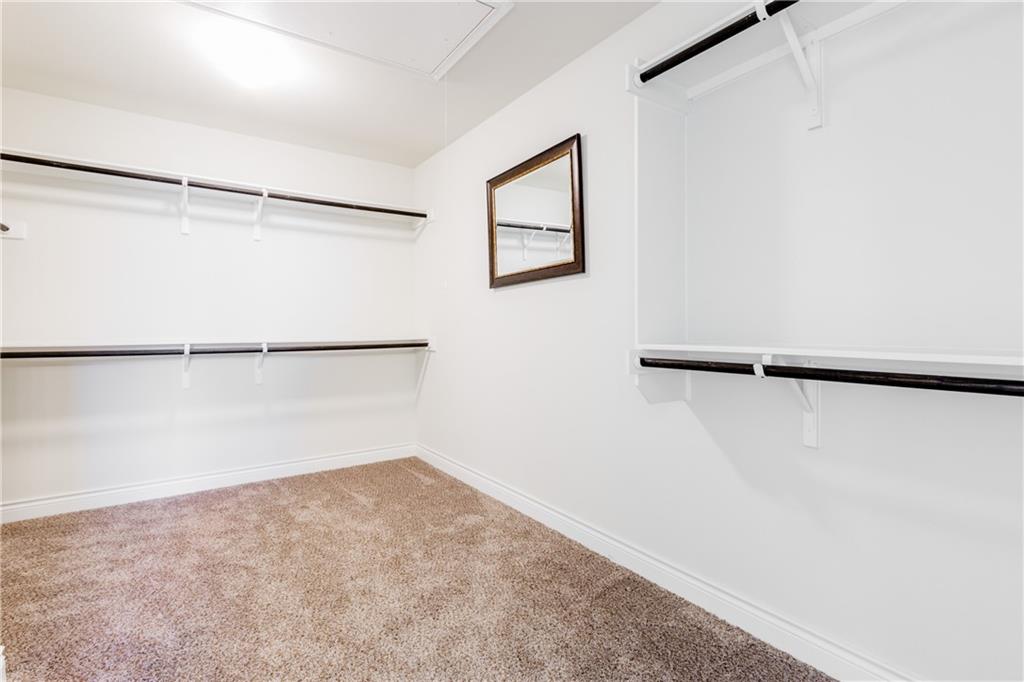 2104 Pindos Pony Way Georgetown, TX 78626 - Photo 18 of 30 A spacious walk-in closet offers extensive storage with multiple shelving and hanging options.