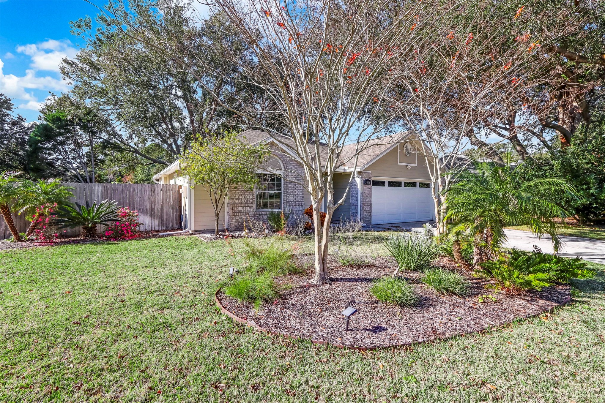 2415 Will Hardee Road Fernandina Beach, FL 32034 - Photo 2 of 59 a front view of a house with garden
