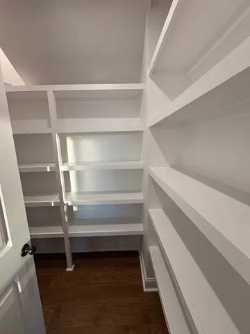 a bedroom with bed and window