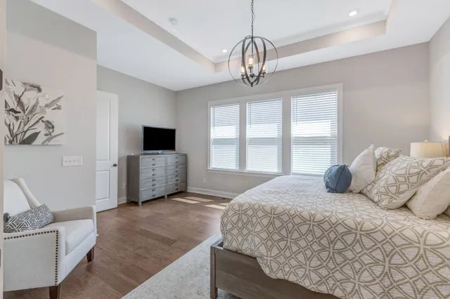 a white bath tub sitting next to a bathroom sink