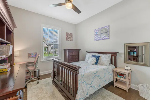 a bedroom with a bed and a table in it